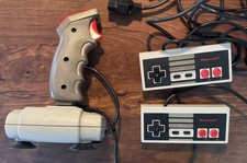 Vintage Nintendo NES controllers and Quickshot joystick
