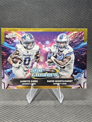 JAHMYR GIBBS & DAVID MONTGOMERY 2025 TOPPS CHROME COSMIC STAR CLUSTERS GOLD /50