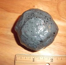 Splat rock toy, splats flat then morphs back throw on a smooth clean surface