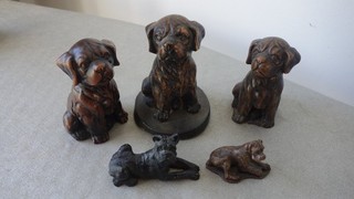 Group of Bronze effect Boxer Dogs and one Terrier