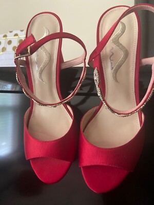 Red Nima 4 inch High heel shoe with strap. 