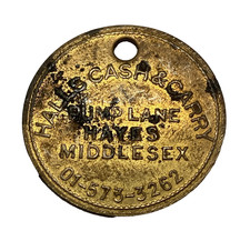 Halls Cash and Carry Hayes, Middlesex brass token member number 2073 circa 1970