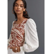 Anthropologie love the label zebra laser cut puff sleeve smocked blouse