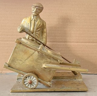 Vintage Brass Man with Broom next to Dustcart