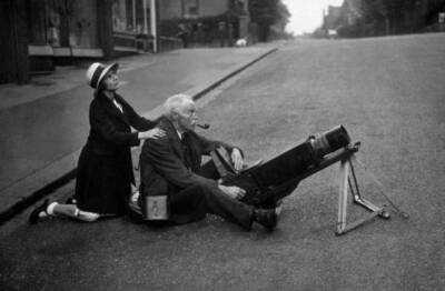 amateur astronomer photographing eclipse sun middle road, assisted - 1936 Photo