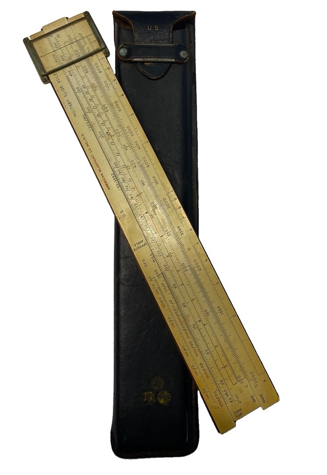 A WWII-era military artillery slide rule with original case — an actual piece of battlefield computation history used to calculate shell trajectories.