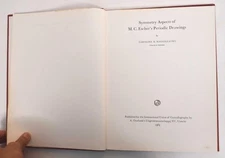 Symmetry aspects of M.C. Escher's periodic drawings,