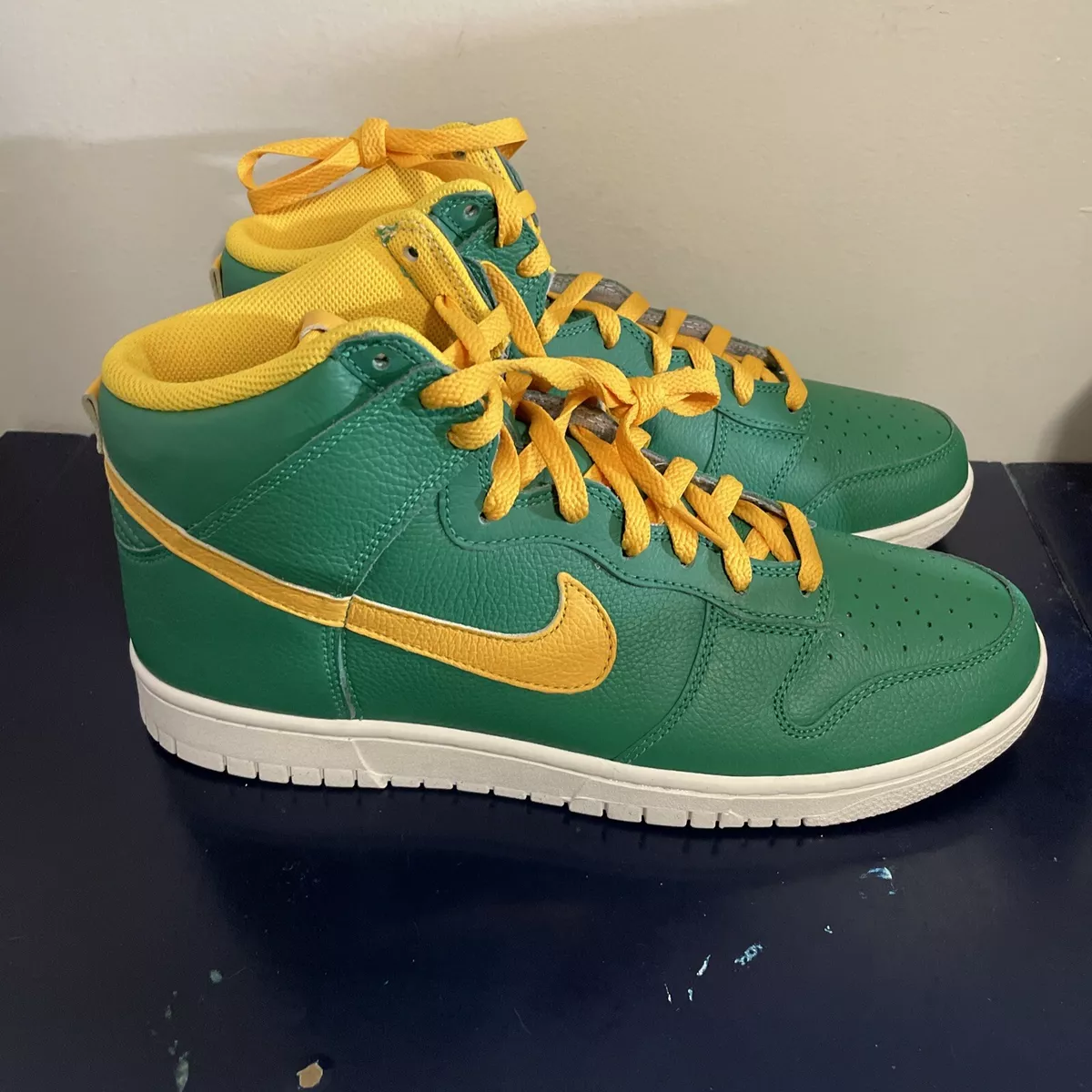 Green and yellow nike dunks high top