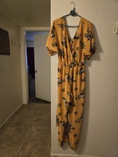 Yellow floral jumpsuit with short sleeves
