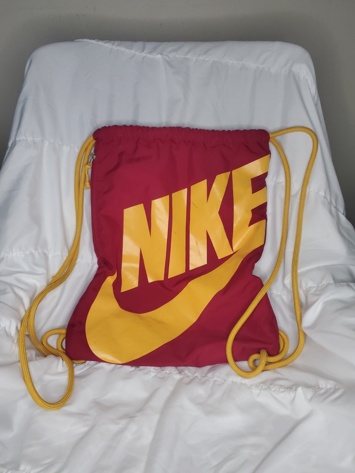 Nike Red with yellow Swoosh Logo Preowned Drawstring Bag side zipper
