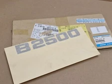 Mazda B2500 Emblem Decal US28517214Z US28-51721- 4Z Genuine NEW