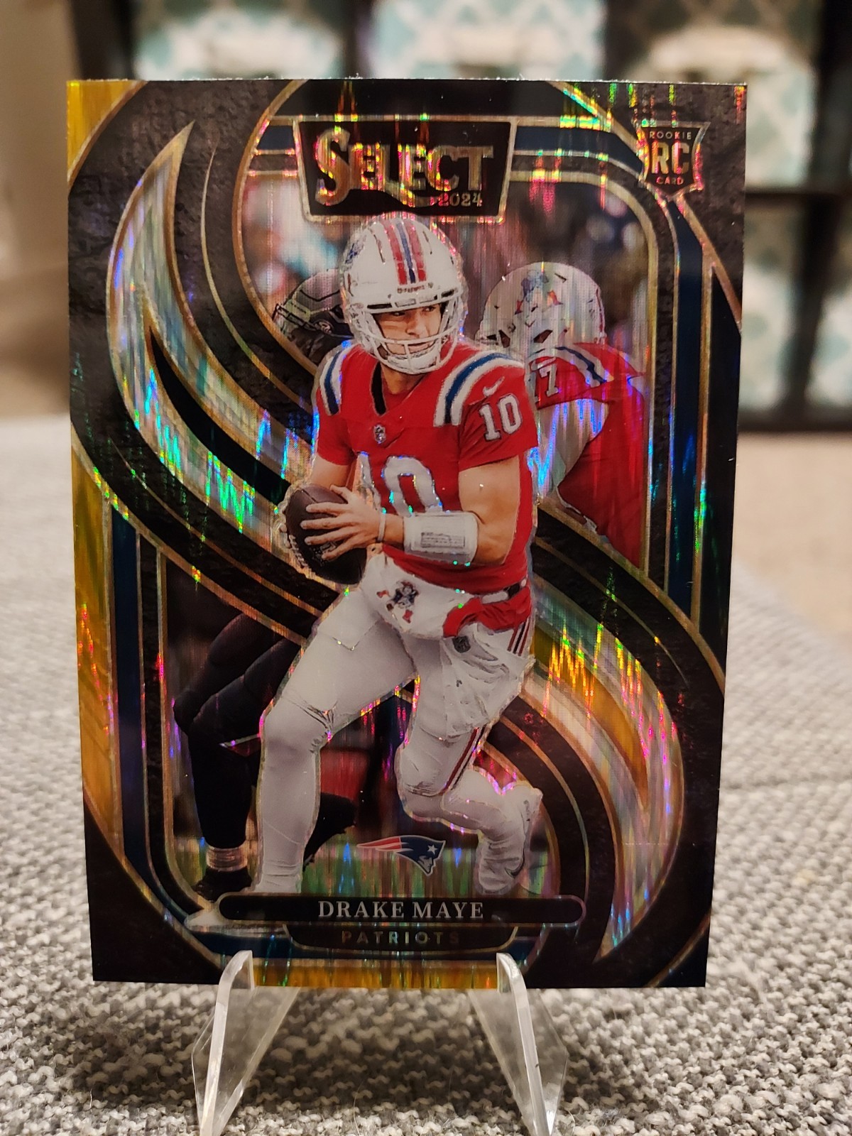 2024 Panini Select - Premier Level Drake Maye #113 Black & Gold Shock Prizm (RC)