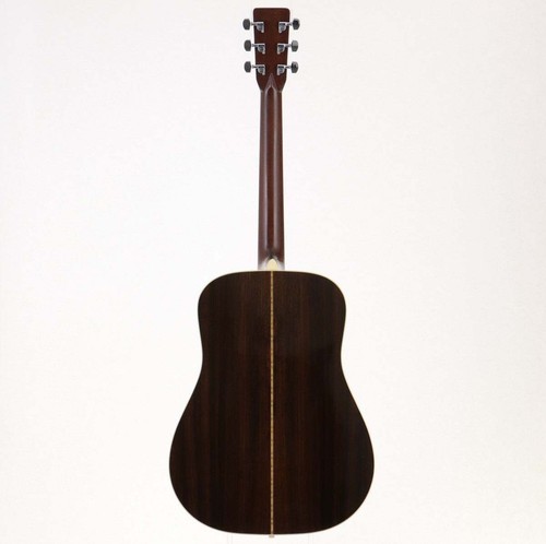 Dark wood Martin D-28 acoustic guitar with light wood fretboard, six silver strings, and ornate brown hardware case.