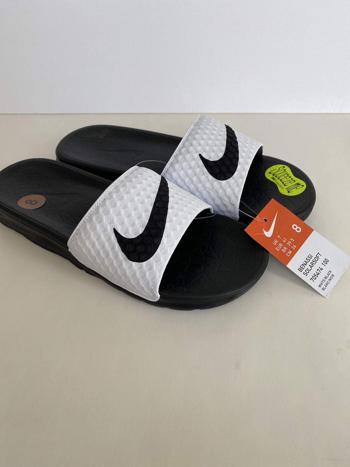 red and black nike slippers