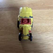 Corgi Juniors: Small yellow toy tractor 1960s