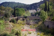 PHOTO  THE OLD ROMAN BRIDGE WHICH CROSSES A TORRENT SURROUNDING POLLENSA ON MALL