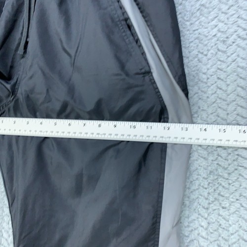 Pantalones deportivos Under Armour cortavientos para hombre medianos negros grises forrados cremallera al tobillo * - Imagen 12 de 14
