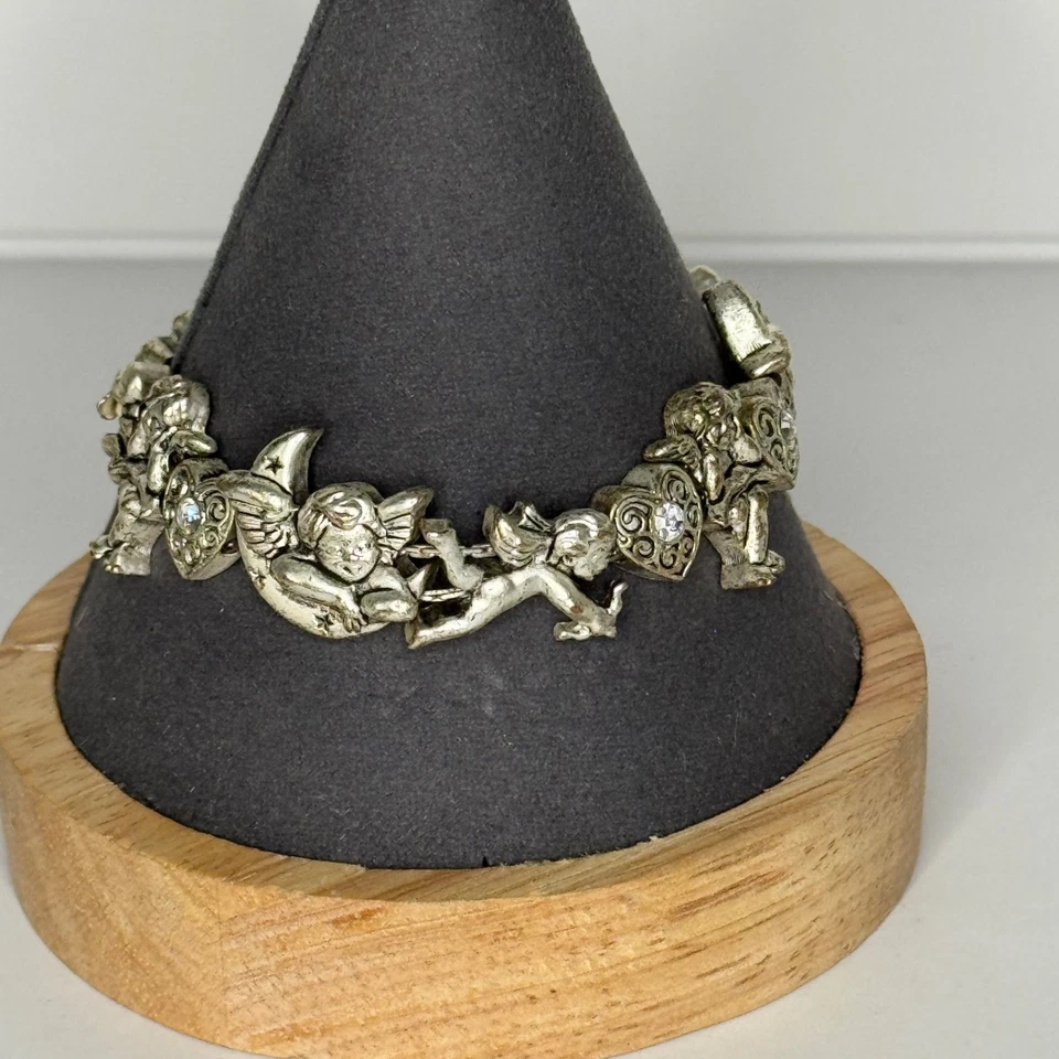 Pulsera de eslabones de ángel querubín Avon corazones diamantes de imitación tono plata Foto 4 de 4
