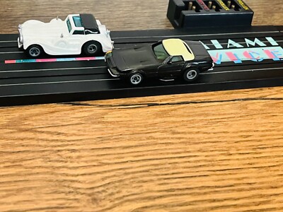 Miami Vice slot track with cars. Track and cars only. Fits Tyco AFX LL