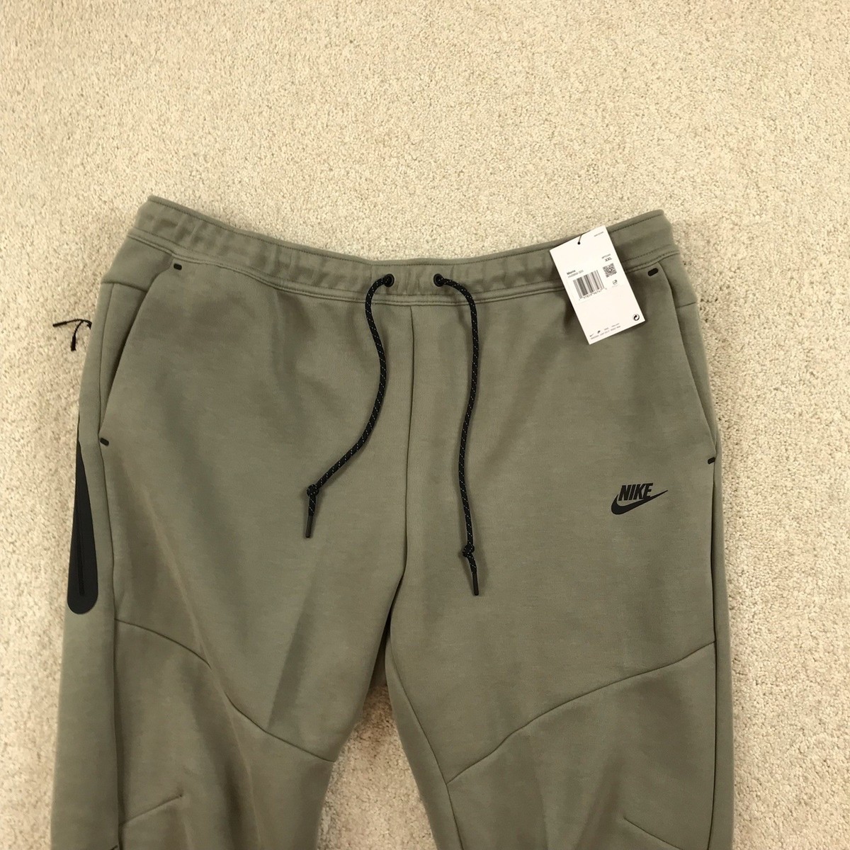 パンツ vintage nike gimmick tech design pants Nike Tech Woven oversized pants in khaki | ASOS