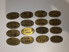 Lot of 16 BRASS  BEACH  BADGE/TAGS