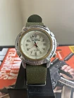 Vintage Timex Expedition Indiglo watch with a green NATO-style band
