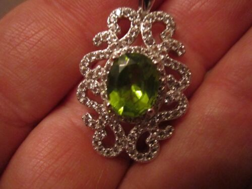 3.23 CARAT PERIDOT PENDANT - STERLING SILVER WITH DOZENS OF WHITE TOPAZ STONES - Picture 1 of 4