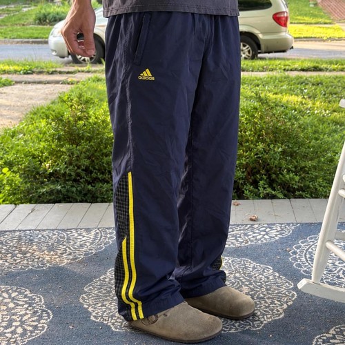 Adidas, Mens Vintage 90s Adidas navy blue nylon track pants with yellow stripes, size L