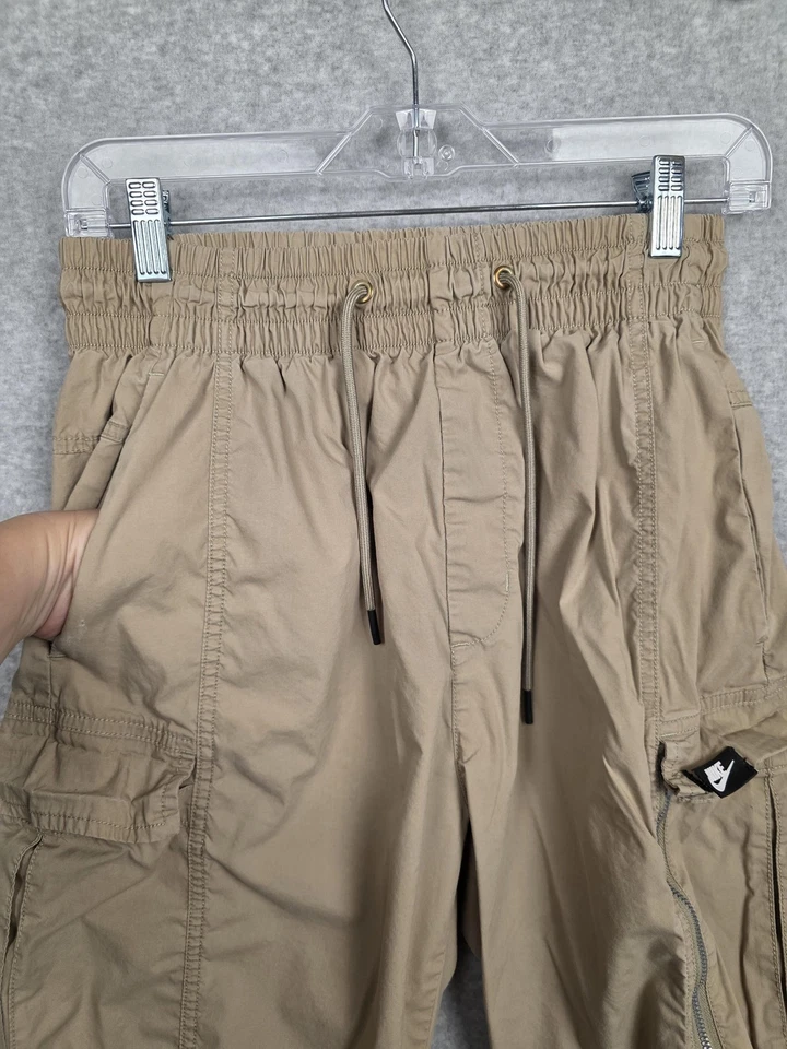 Pantalones Nike Para Hombre Medio Bronceado Carga Joggers Cintura Elástica Cremallera Bolsillo Tobillo Puños Foto 4 de 4