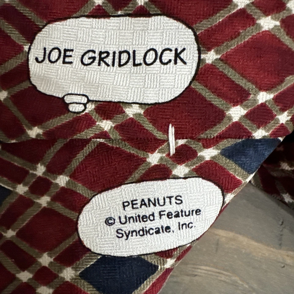 Corbata oficial para hombre Peanuts Snoopy Joe Gridlock 100 % seda granate y azul usada en excelente estado  Foto 4 de 4