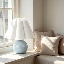 Blue Ceramic Table Lamp with Pleated Shade for Sunlit Window Sill