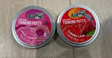 Lot Of 2 Aaron's Crazy Liquid Glass Thinking Putty 1.06 oz Rose, Lava