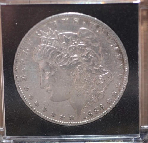 1886 morgan silver dollar in AU condition