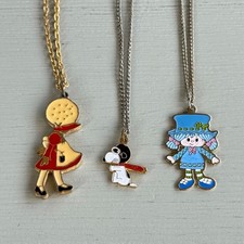 Lot of 3 Vintage 1980s Girls Necklaces Snoopy Holly Hobbie Strawberry Shortcake