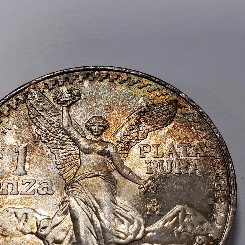 1985 Mo Mexico Libertad Onza 1 oz .999 Silver BU - Rainbow Toning - SKU-U2876 - Image 2 of 4