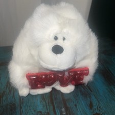 White singing gorilla or monkey plush toy holding a red "LOVE  Works
