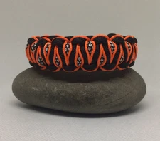 CHECK OUT THIS BLACK ORANGE & SILVER PARACORD SURVIVAL BRACELET