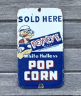VINTAGE 7x4" POPEYE WHITE HULLESS POPCORN SODA POP GASOLINE OIL PORCELAIN SIGN