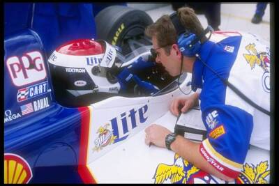 Bobby Rahal confers with a crew member at the Marlboro Grand Prix - Old Photo