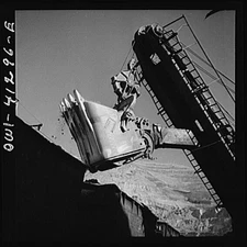 Bingham Canyon, Utah. Huge dipper of a shovel loading ore into cars at a mine