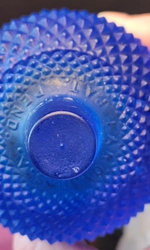 Cobalt blue glass tulip-shaped votive candle holder with textured rim, made in the USA.