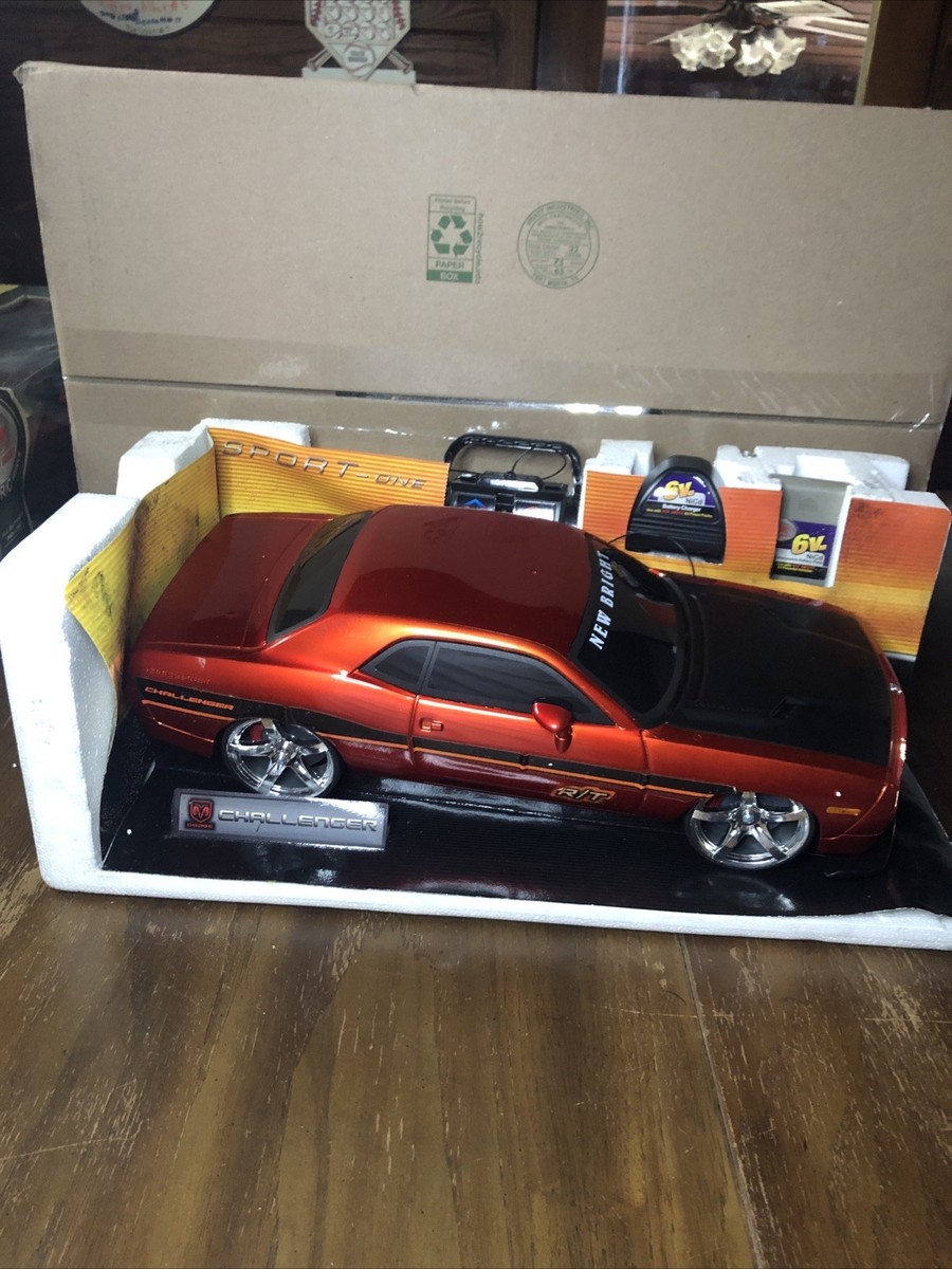 New Bright DODGE CHALLENGER R/T 49 MHz Orange 9.6V Remote Control