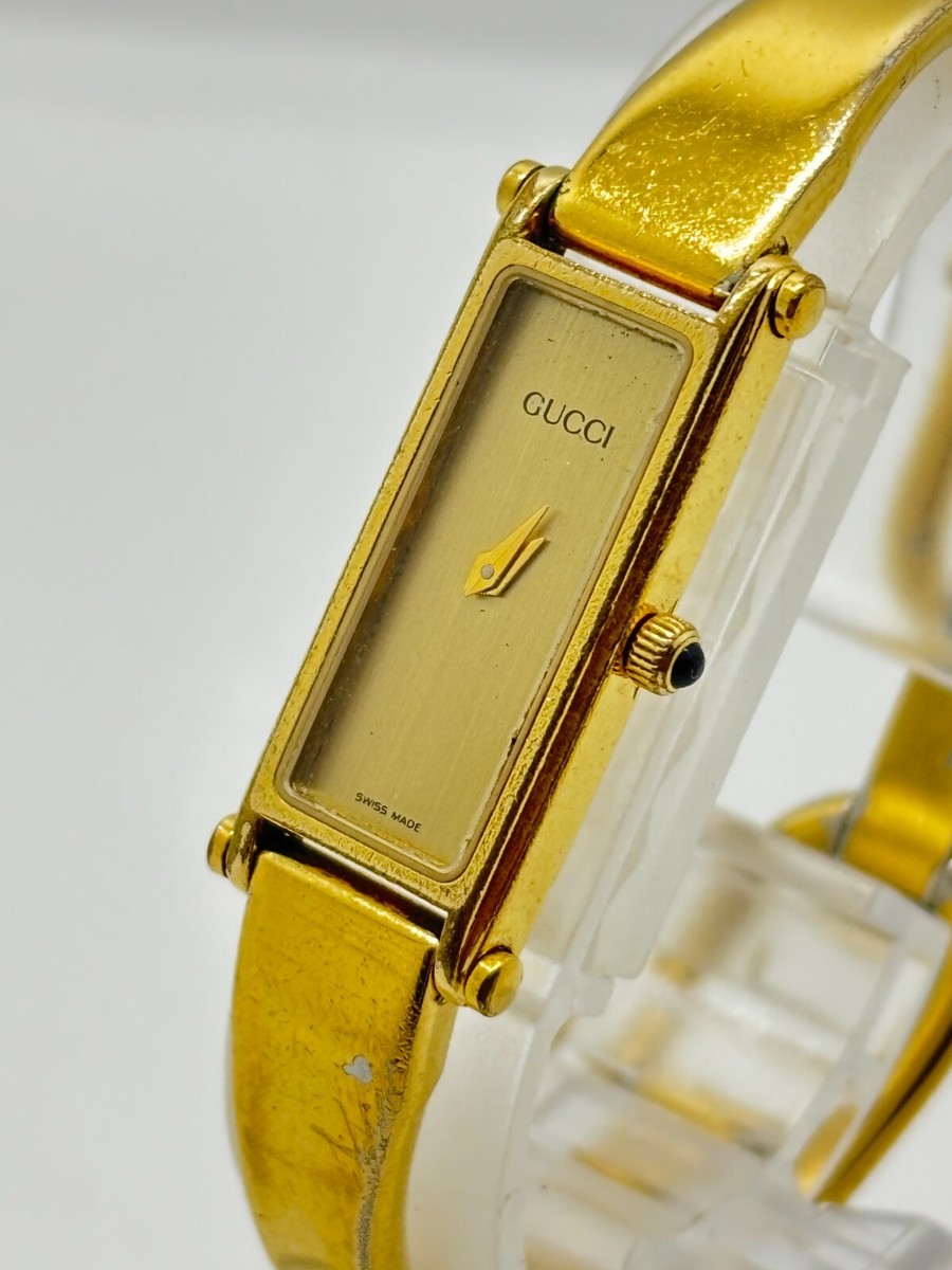 Ladies Gucci Gold Tone Black Dial 1500 Bangle Watch for sale