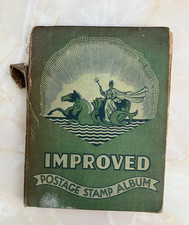 VINTAGE "IMPROVED POSTAGE STAMP ALBUM"  OVER 600 STAMPS COLONIAL AND WORLD  (H)