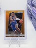 Paul George 2024-25 Panini Prizm Basketball Orange Prizm 1/49 #110 – Deca SP