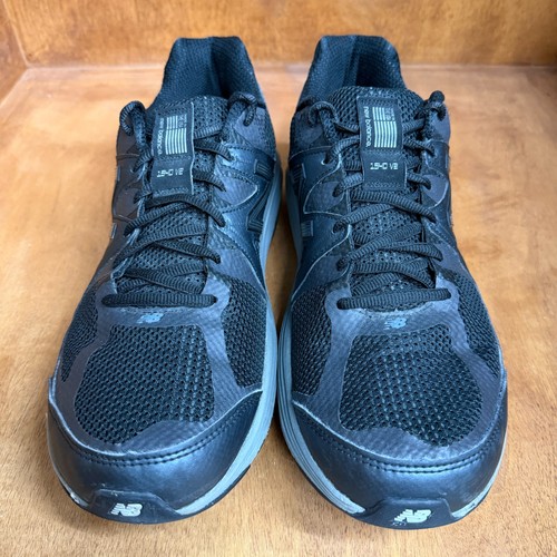 Black and gray New Balance 1540V2 men’s running shoes with mesh uppers, suede overlays, and large white “1540V2” text.