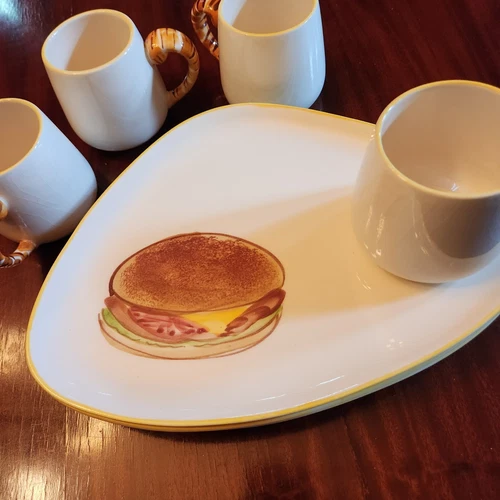 Great conversation piece! 4 Vintage CA pottery lunch plates and mugs.