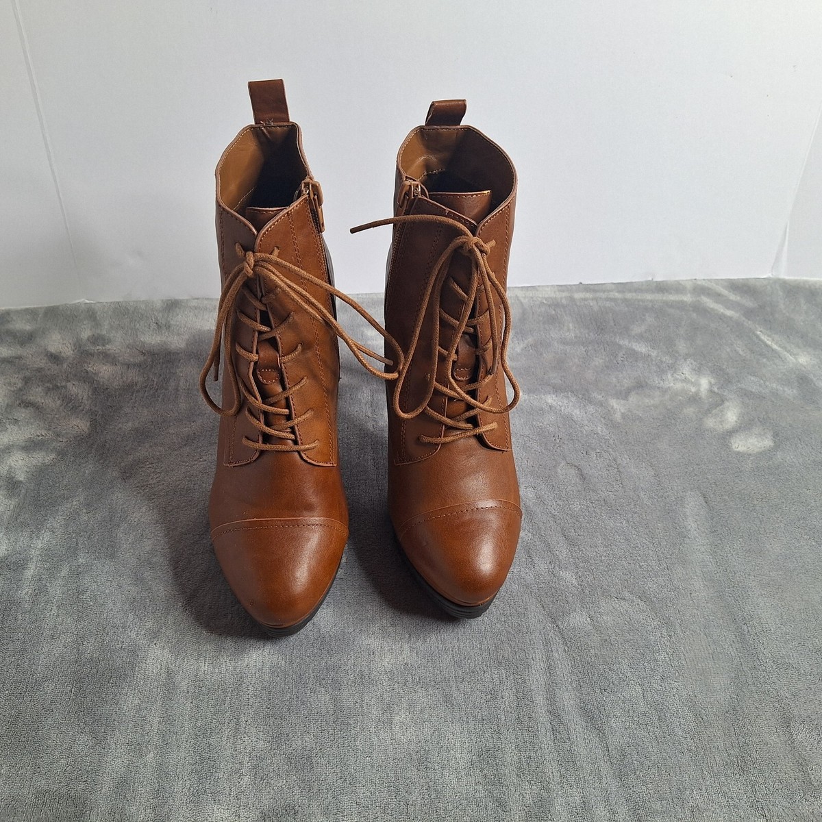 Forever 21 ankle boots in brown with lace-up design and high heels featuring side zip closure