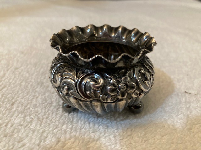 Antique sterling silver Repousse’ salt cellar, 1.5” tall 2”diameter. 26 grams