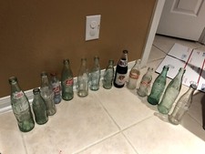 Lot of 14 vintage Coca Cola bottles